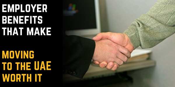 People shaking hands because they agreed on the employer benefits that make moving to the UAE worth it